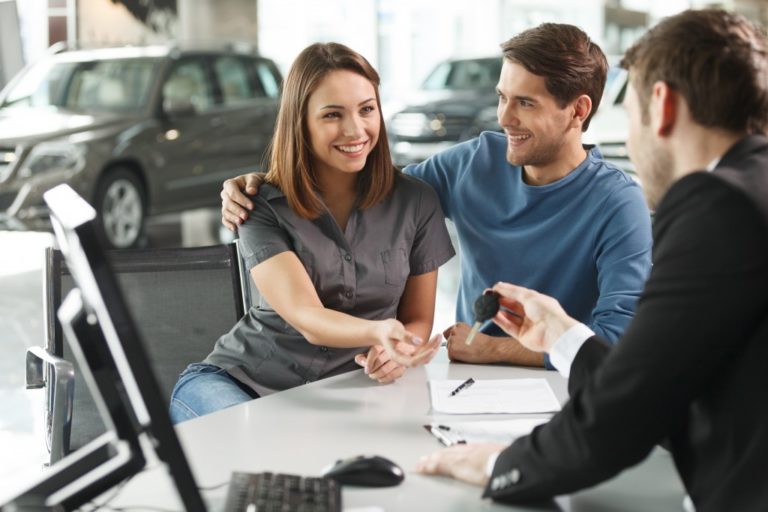 Couple buying new car